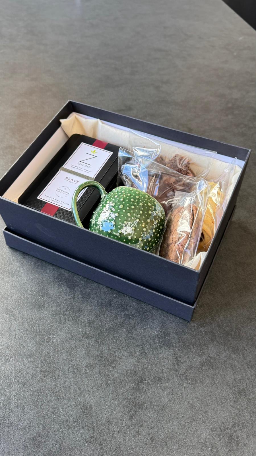 The Grand Tea Ritual gift box with Zealong tea, a handmade Curios ceramic mug and patisserie treats